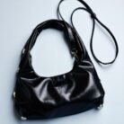 Bolso sach negro detrás elegante